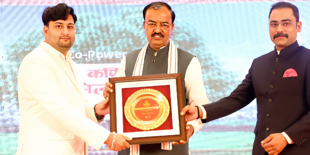 Dr. Prince Kumar Mishra receiving Uttar Pradesh Best Homeopathy Practitioner Award from Deputy Chief Minister, Government of UP